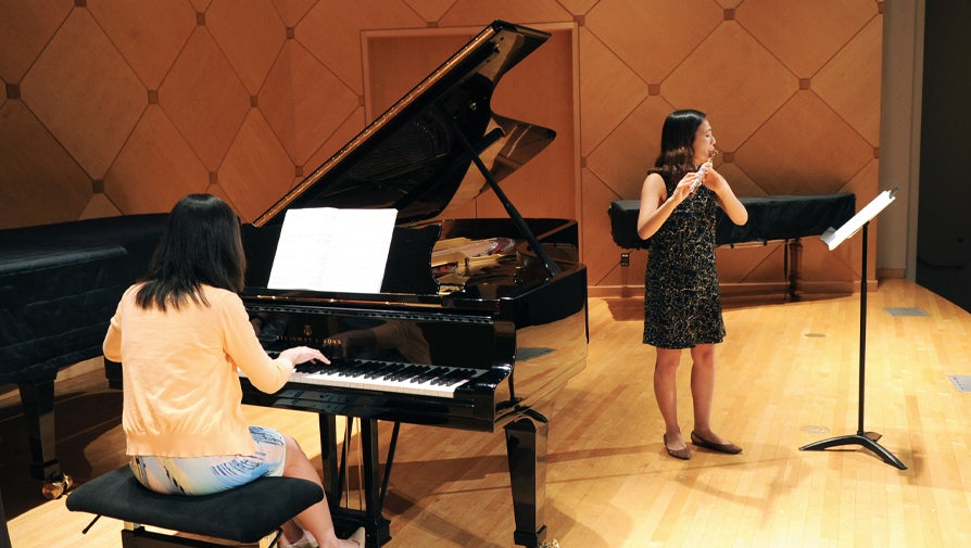 performers playing flute and piano