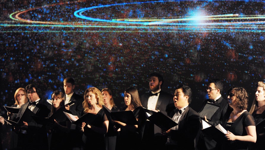 choir singing with galaxy background