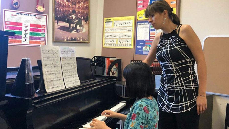 faculty teaching piano