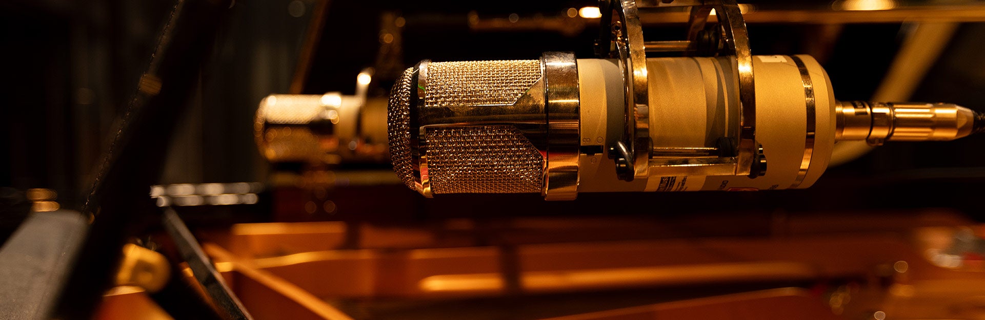 Studio microphones over a piano