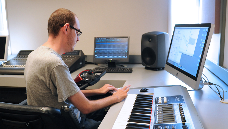 student working on a desktop with keyboard