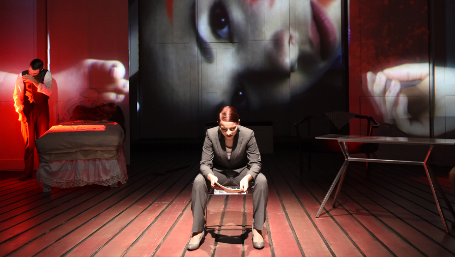 actor sitting on stage